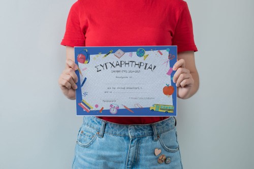 female-student-holding-blank-project-sheet copy